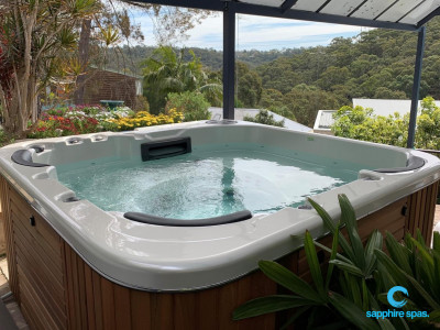 The perfect spot for this silverwhite spa with natural handcrafted western red cedar cabinet