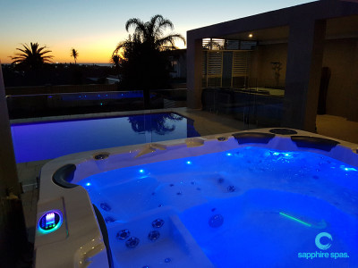Spa pool overlooking inground swimming pool thanks to the team @ West Coast Spas Perth